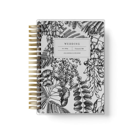 Shown in a black and white ferns and foliage design, our exclusive LGBT wedding planner books are all-inclusive and gender-neutral