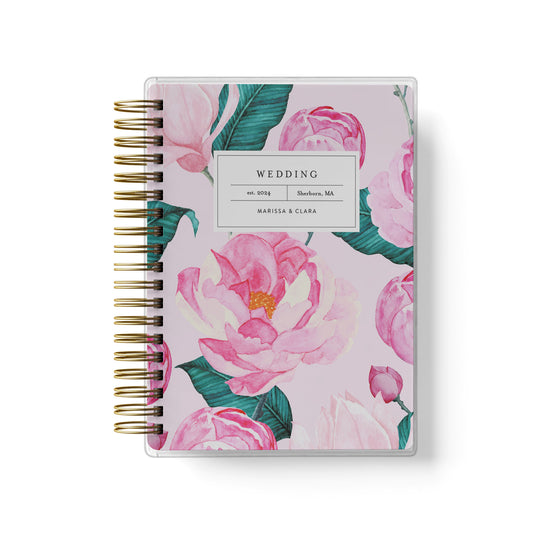 Shown in a pink peony design, our exclusive LGBT wedding planner books are all-inclusive and gender-neutral