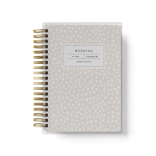 Shown in a spotted dot design, our exclusive LGBT wedding planner books are all-inclusive and gender-neutral
