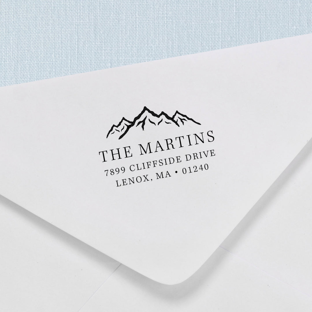 Custom return address stamp in a mountain range design