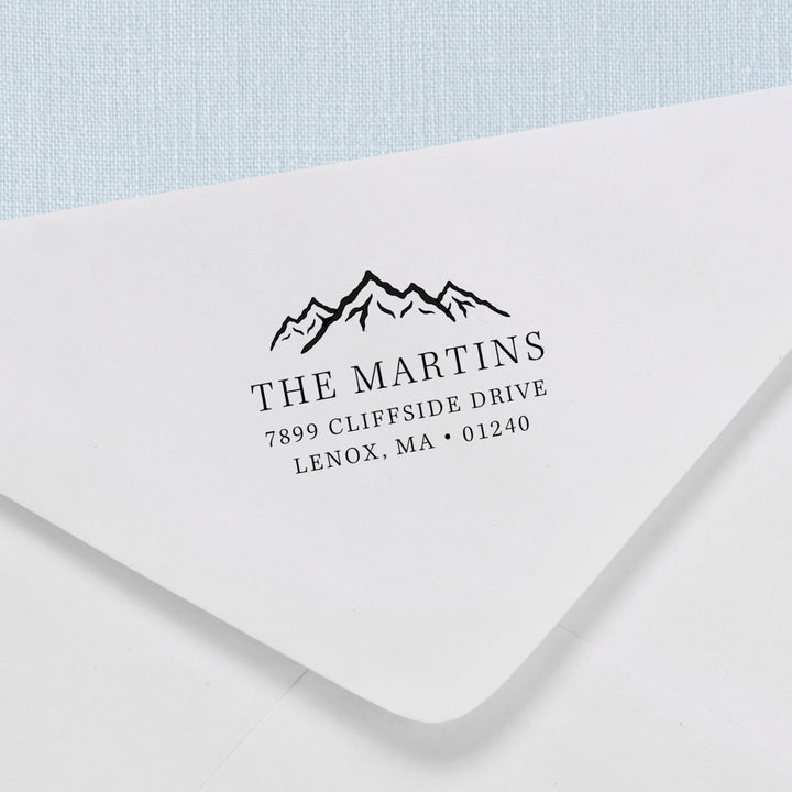 Custom return address stamp in a mountain range design