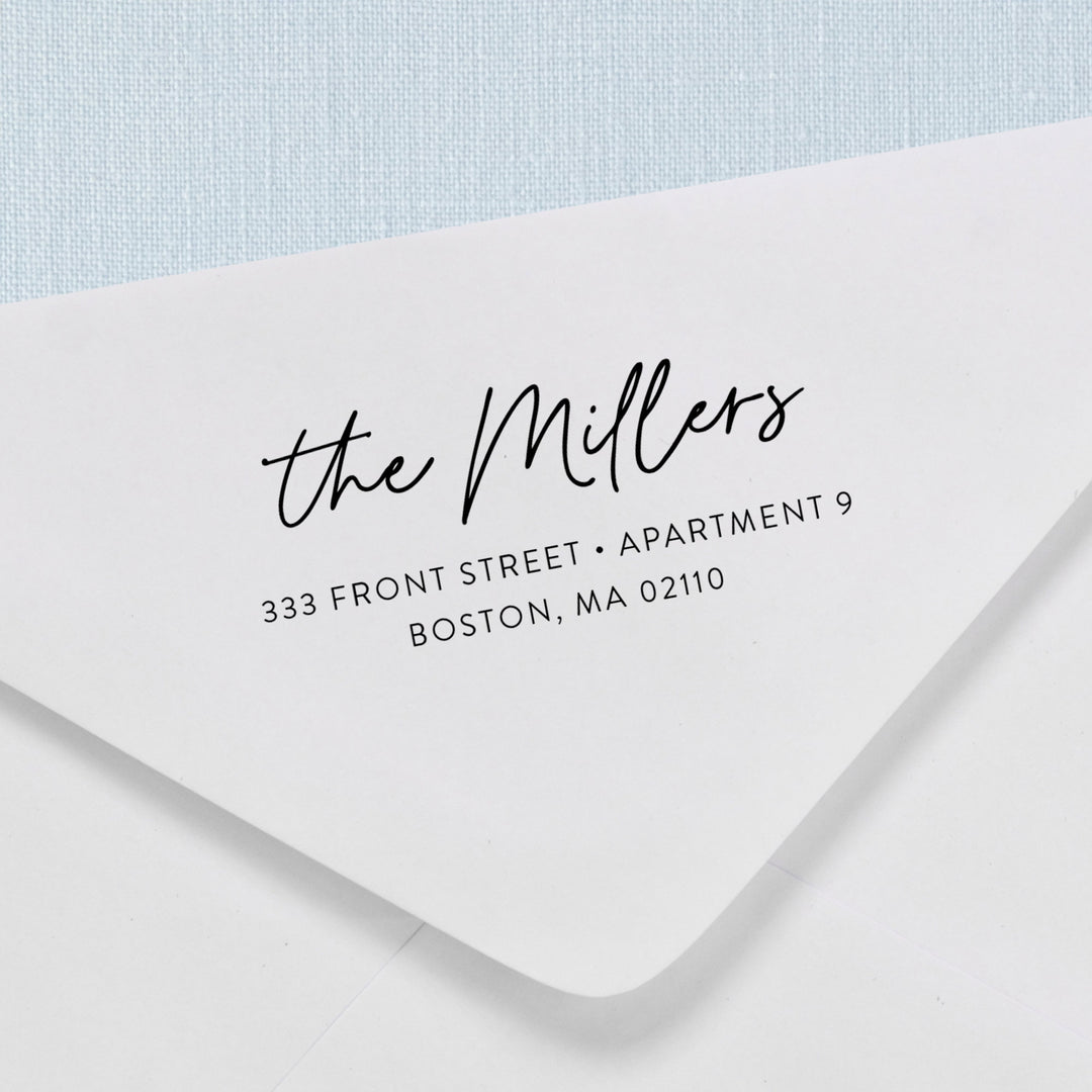 Custom return address stamp in a modern calligraphy script design