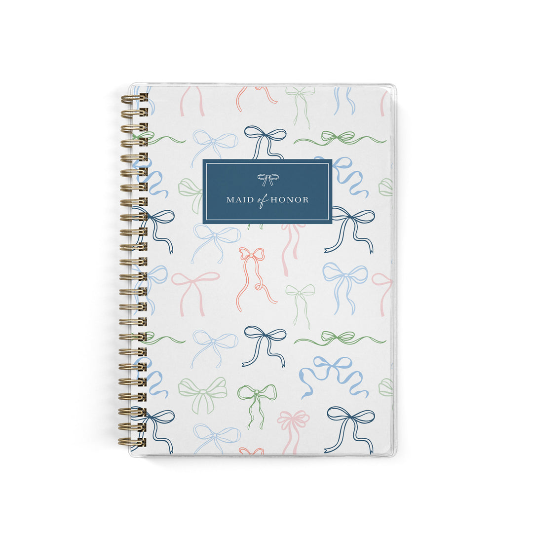 Our exclusive maid of honor planners are the perfect gift for your best friend, shown in a delicate bow design.