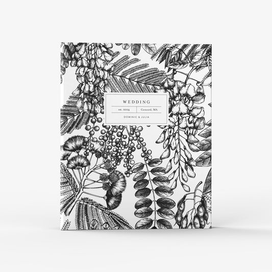 Our wedding binders are the perfect planning tool, shown in a black and white botanical print
