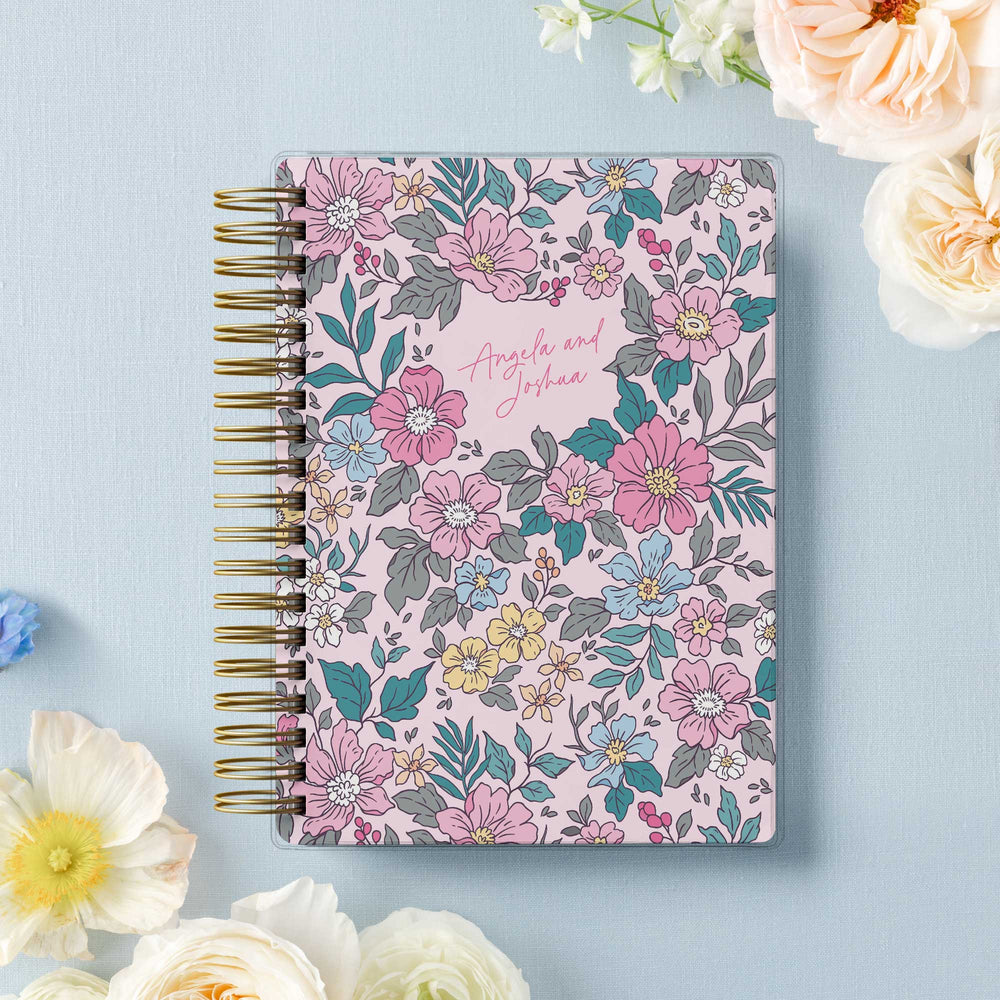 Our soft cover wedding planners are  the best option for brides on a budget, shown in colorful garden floral design.