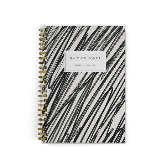 Our exclusive maid of honor planners are the perfect gift for your best friend, shown in a modern scribble design