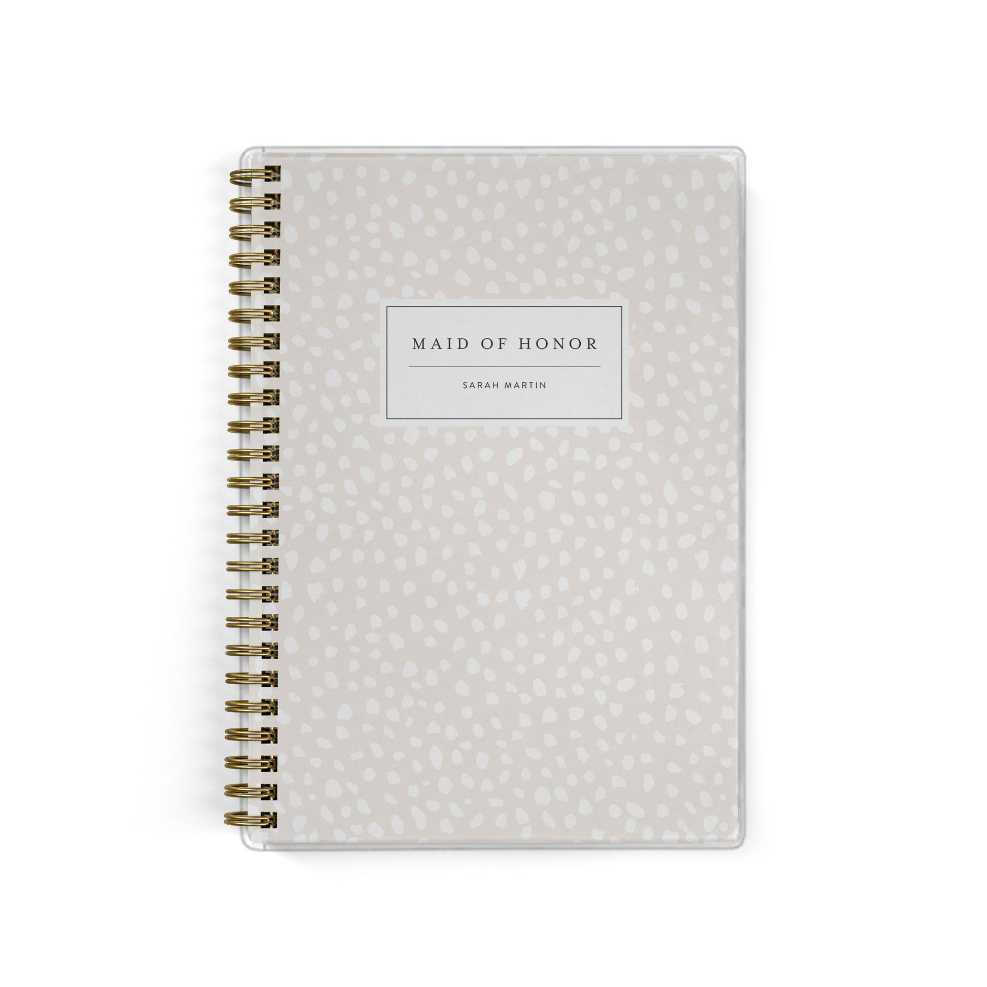 Our exclusive maid of honor planners are the perfect gift for your best friend, shown in a spotted dot design