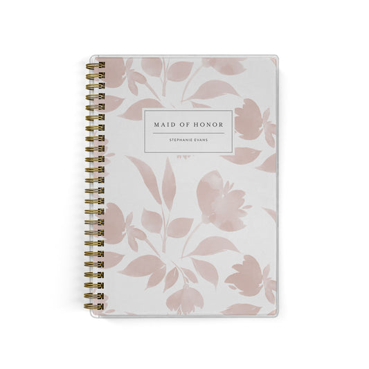 Our exclusive maid of honor planners are the perfect gift for your best friend, shown in a watercolor floral print