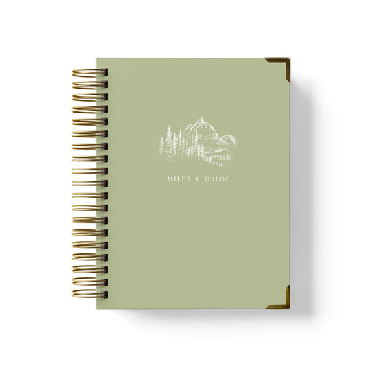 Our luxury wedding planner books are the best a bride can buy, featuring a mountain vista with trees design