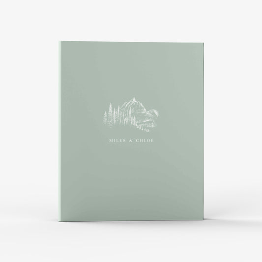 Our wedding binders are the perfect planning tool, design shows a mountain vista with trees