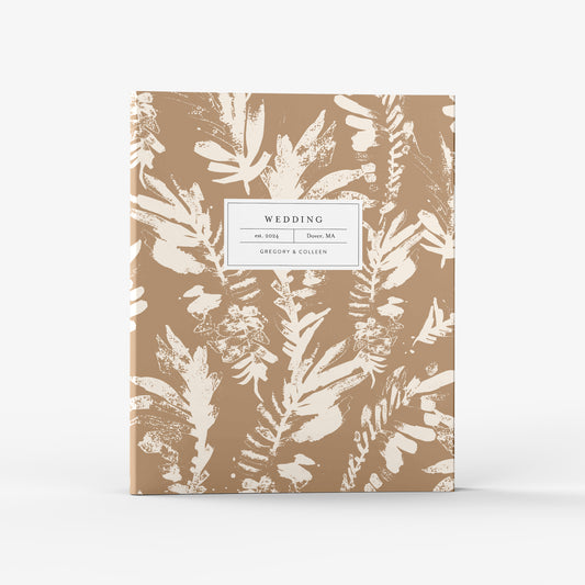 Our wedding binders are the perfect planning tool, shown in a neutral boho leaf pattern
